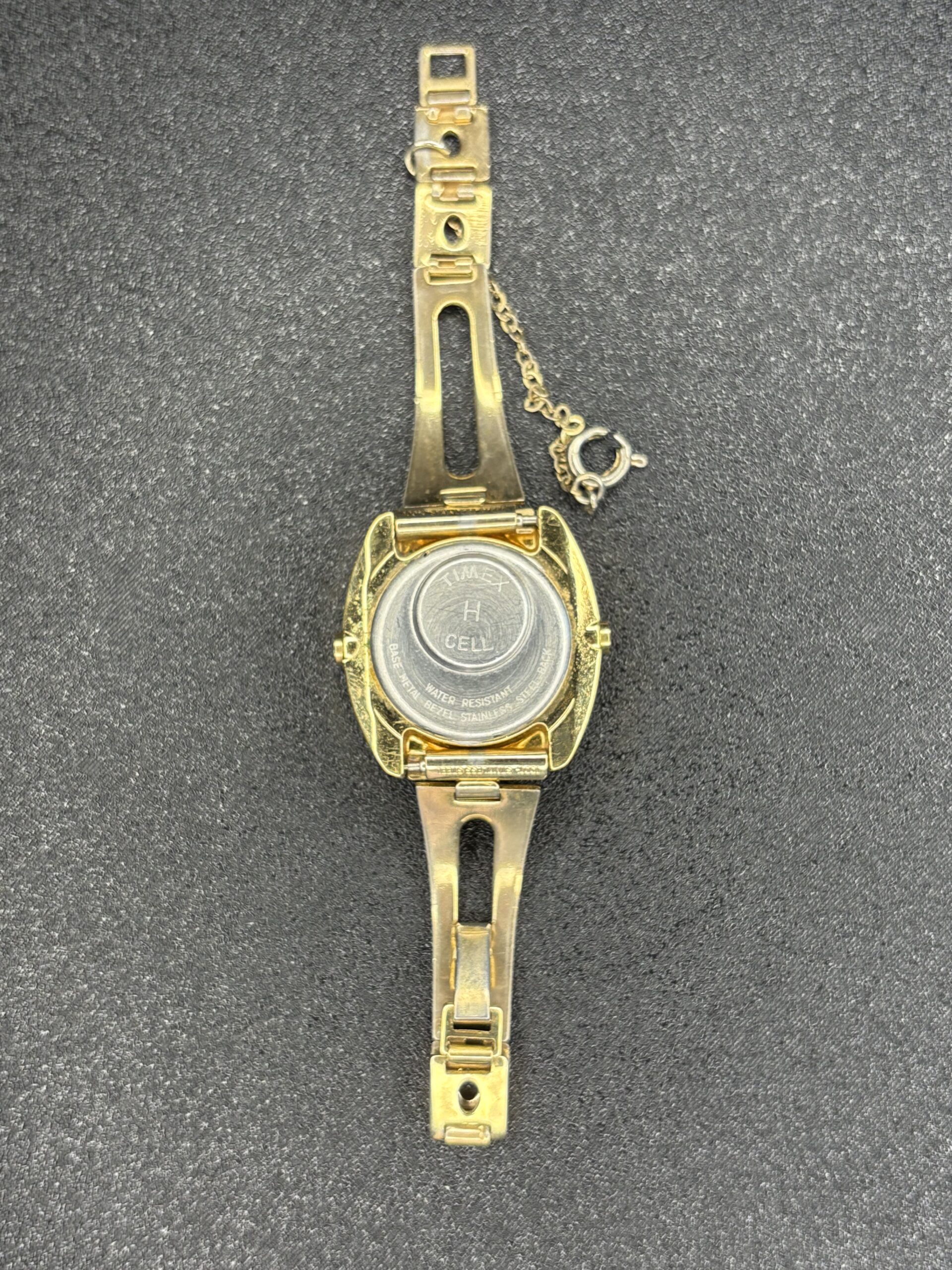 Timex SSQ Gold-Plated Oval Digital Watch with Vintage Charm - Image 2