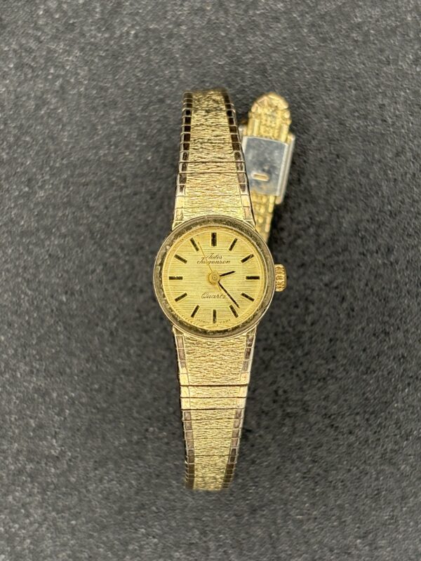 ules Jurgensen Women’s Quartz Watch Gold Tone Textured Band