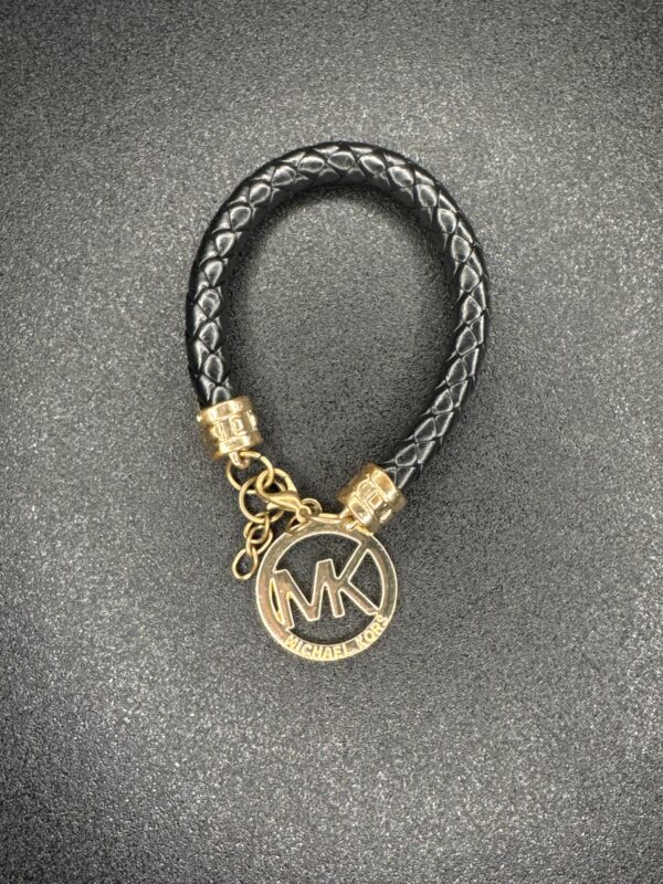 Micheal Kors Black And Gold Bracelet